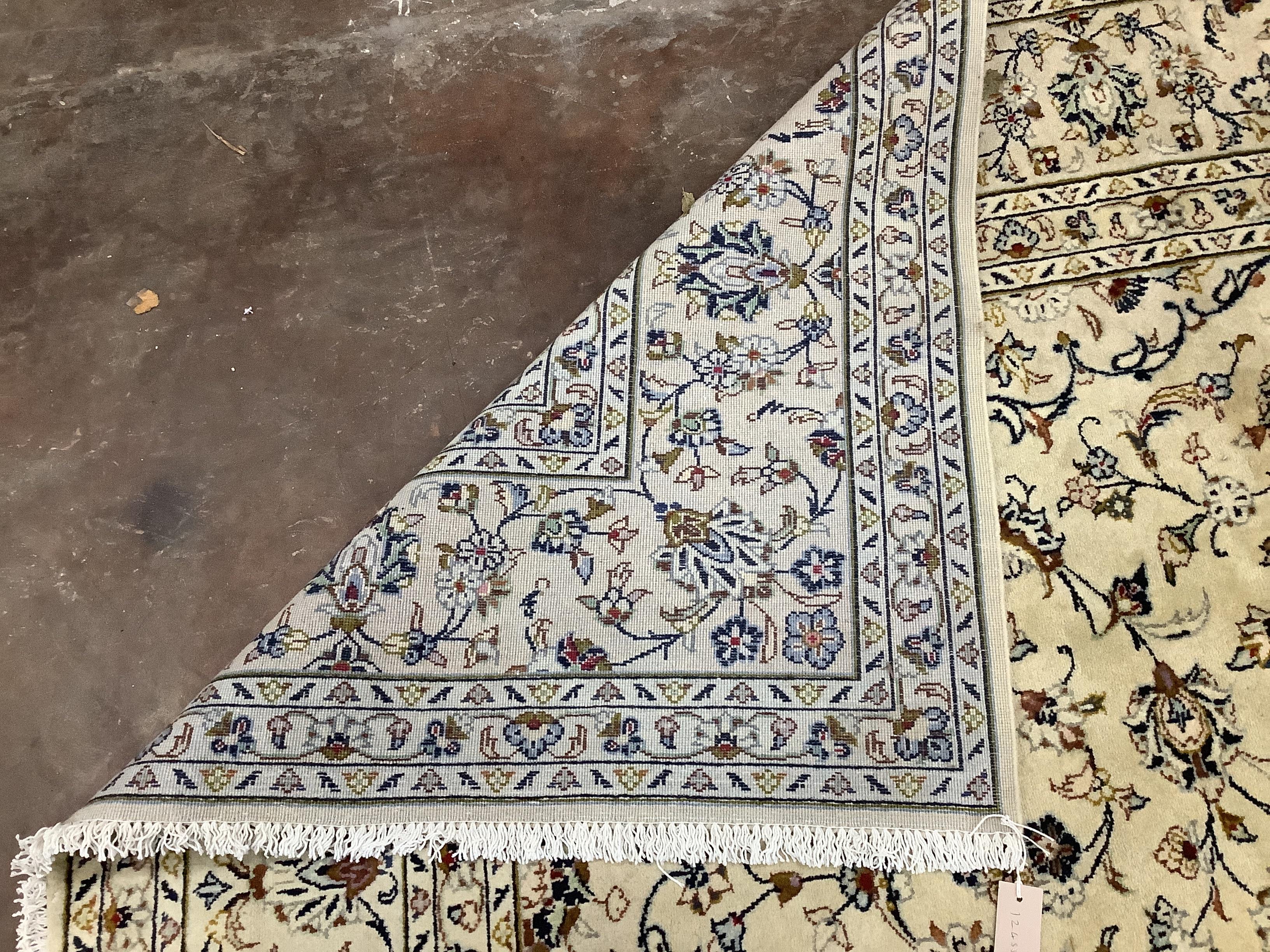 A Kashan ivory ground carpet, 348 x 244cm